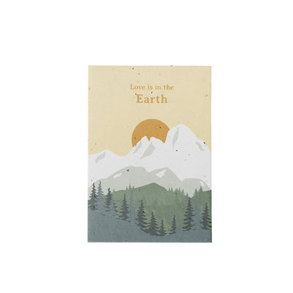 Postal Plantable "Love Is In The Earth" con Semillas de Manzanilla – Regalo Romántico - Resetea_0
